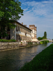 Fototapeta premium Historic buildings along the cycleway of Naviglio Grande, Milan, Italy, at Robecco
