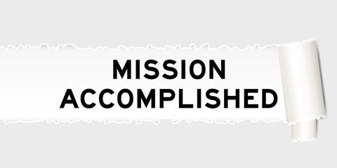 Ripped gray paper background that have word mission accomplished under torn part