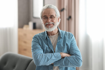 Portrait of happy grandpa with glasses indoors