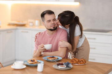 Lovely couple spending time together during breakfast at home