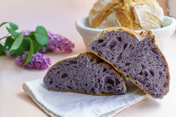 Homemade Artisan Purple Bread Sourdough Made from Purple Sweet Potato. with natural color. Purple tartine cut into slices.