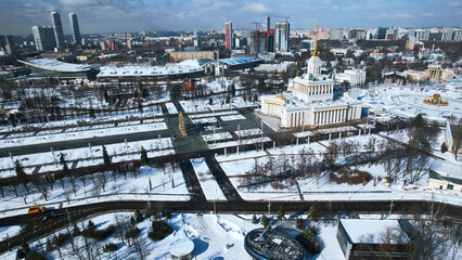 Fototapeta premium Top view of square with historical building in winter. Creative. center of the Soviet city with square and historical building. Beautiful urban landscape with historical center and square in winter