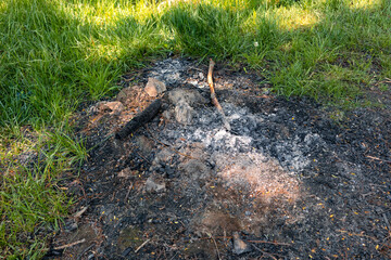 Campfire place with coals. Coals from an extinguished fire