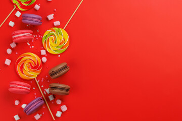 Various colorful candies, lollipops, and macaroons