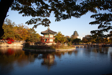 View of the wooden pavilion and reflection on the pond in Gyeongbok Palace