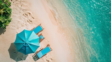 Naklejka premium Tropical vacation background. Sun lounger with umbrella and beach accessories for active rest on the sandy island, copy space, top view