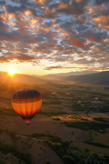 Obraz premium a sunrise hot air balloon ride over a scenic landscape