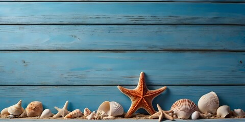 Sea shells and starfish on blue wooden background.