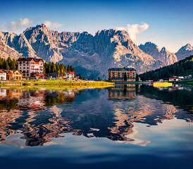 Sorapis peak reflected in the calm waters of Misurina lake. Amazing summer view of Tre Cime di...