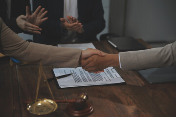 Judge gavel with Justice lawyers having team meeting at law firm background. Concepts of Law and...