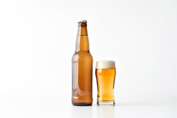 Beer bottle and glass on white background