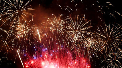 Red Firework celebrate anniversary in night time celebrate national holiday. Happy new year 2024,...