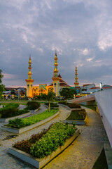 Tegal City Grand Mosque in the afternoon with beautiful sunset light behind it and the green Tegal city square park