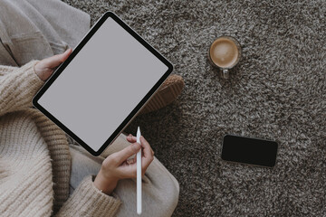 Top view tablet mockup with copy space. Woman using digital tablet with blank white desktop screen