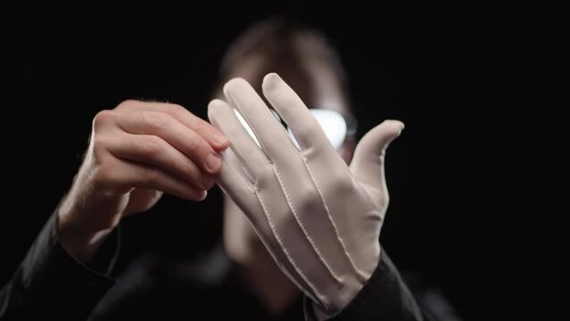 Anime villain with glowing eyeglasses remove white gloves removes restraint 4K