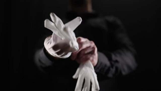 Headless mystery person put on white gloves take action 4K