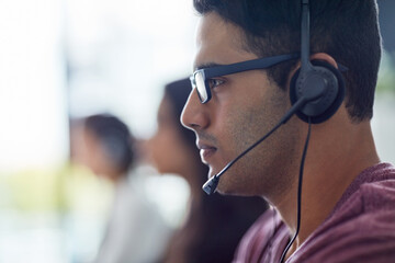 Call center, agent and man with headset in office for communication, customer support or CRM. Lens...