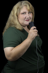 A Portrait of a 50-Year-Old Caucasian White Woman with Blonde Hair, Holding a Microphone Against a...
