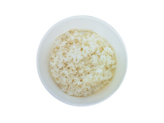 Boiled rice in a white cardboard plate. View from above. Isolate.