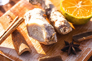 ingredients used to make winter drink, ginger, lemon, cloves, cinnamon sticks or anise. Ingredients for a Brazilian drink called "quentão"