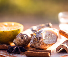 ingredients used to make winter drink, ginger, lemon, cloves, cinnamon sticks or anise. Ingredients...