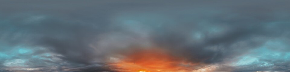 Dramatic Sunset sky 360 panorama. Vibrant sky with bright glowing red pink Cumulus clouds. HDR 360 seamless spherical panorama. Sky dome for aerial drone panoramas. Climate and weather change.