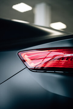 Modern rear light on new matte black automobile