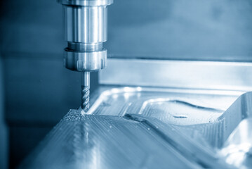 The CNC milling machine cutting press die part by solid bull end mill tool and G-code data...