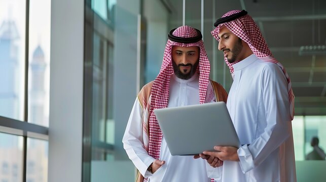 International Operations Manager Meeting Saudi Business Partner in Traditional Kandura Theyre Standing in Modern Office Using Laptop Computer Successful Saudi Emirati Arab Businessman  : Generative AI