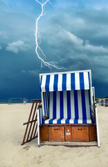 lightning over a beach chair on Baltic Sea beach