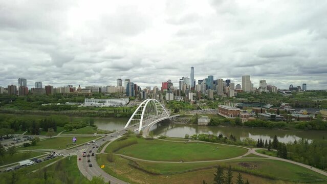 Edmonton downtown skyline with perspective over the Queen Elizabeth II Park, with the Walterdale Bridge featured. The vibrant cityscape, nestled along the North Saskatchewan River.