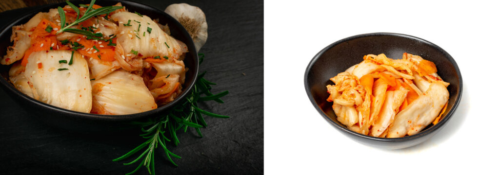 Kimchee in black bowl on stone table. Spicy kim chi pile, hot fermented napa cabbage, traditional jimchi