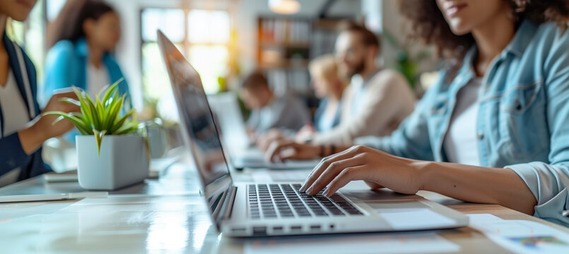 a close-up image of a software tester documenting a bug report on a laptop, with colleagues engaged in testing activities in the background, multiracial, Teamwork, Office, Occupati