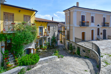 Fototapeta premium A narrow street with old houses in Pietrelcina, a medieval town in Campania, Italy.
