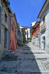 A narrow street with old houses in Pietrelcina, a medieval town in Campania, Italy.