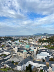 Stunning view of Salzburg city from the top of Fortress Hohensalzburg. The panoramic vista captures the historic architecture and scenic beauty of the city.