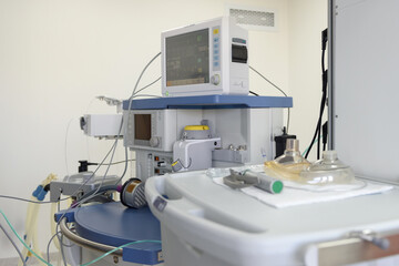 Anesthesia apparatus in the operating room. Complex for inhalation anesthesia. 
Monitor screen with vital signs and ECG data of the patient during surgery. Monitoring a patient under anesthesia.