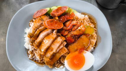 Crispy pork rice on a blue plate on the dining table