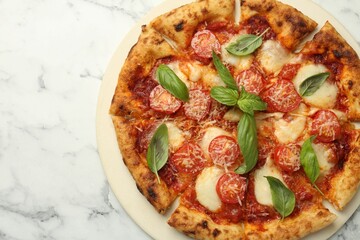 Delicious Margherita pizza on white marble table, top view