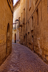 Cobblestone alleyway in Palma de Mallorca, Spain © Wirestock
