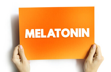 Melatonin is a hormone that your brain produces in response to darkness, text concept on card