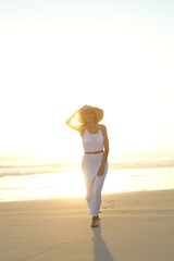 Travel, portrait and woman walk on beach with hat for summer vacation, holiday trip or tropical...