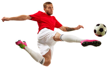 Young soccer soccer player looks confident practicing kicking ball in motion against transparent background. Football school. Concept of game, sport, recreation, active lifestyle. © Lustre Art Group 