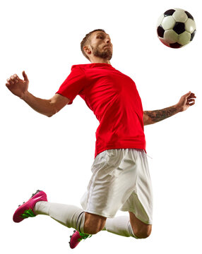Banner. Young fit man, soccer player ready to kick a soccer ball on green grass field against transparent background. Concept of professionals sport, competition, tournament, energy, action.
