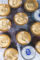 Group of aluminium cans in ice, cold drink.