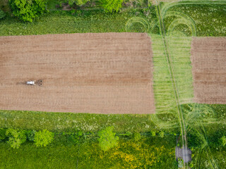 Industrial tractor farming from an aerial view