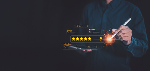 A business professional highlights a perfect five-star rating on a digital interface, showcasing...