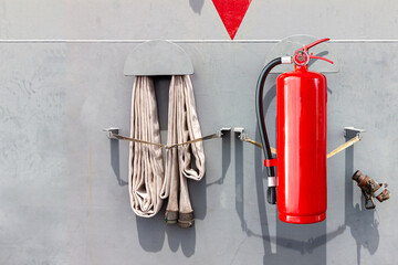 red fire extinguishers available in fire emergencies, safety concept