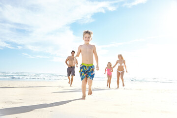 Naklejka premium Portrait, beach and running with vacation, family and happiness with weekend break, sunshine and bonding together. Parents, mother or father with children, kids and seaside for holiday, fun or travel