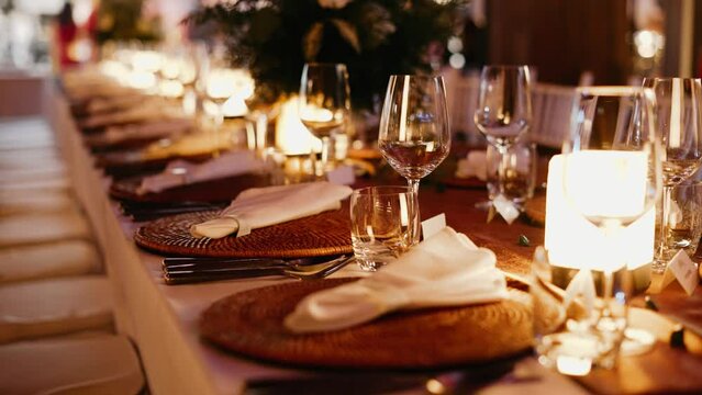 Dinner table setup  Close up decoration flowers candles Wedding decor candle catering dinner luxury event. no people, copy space